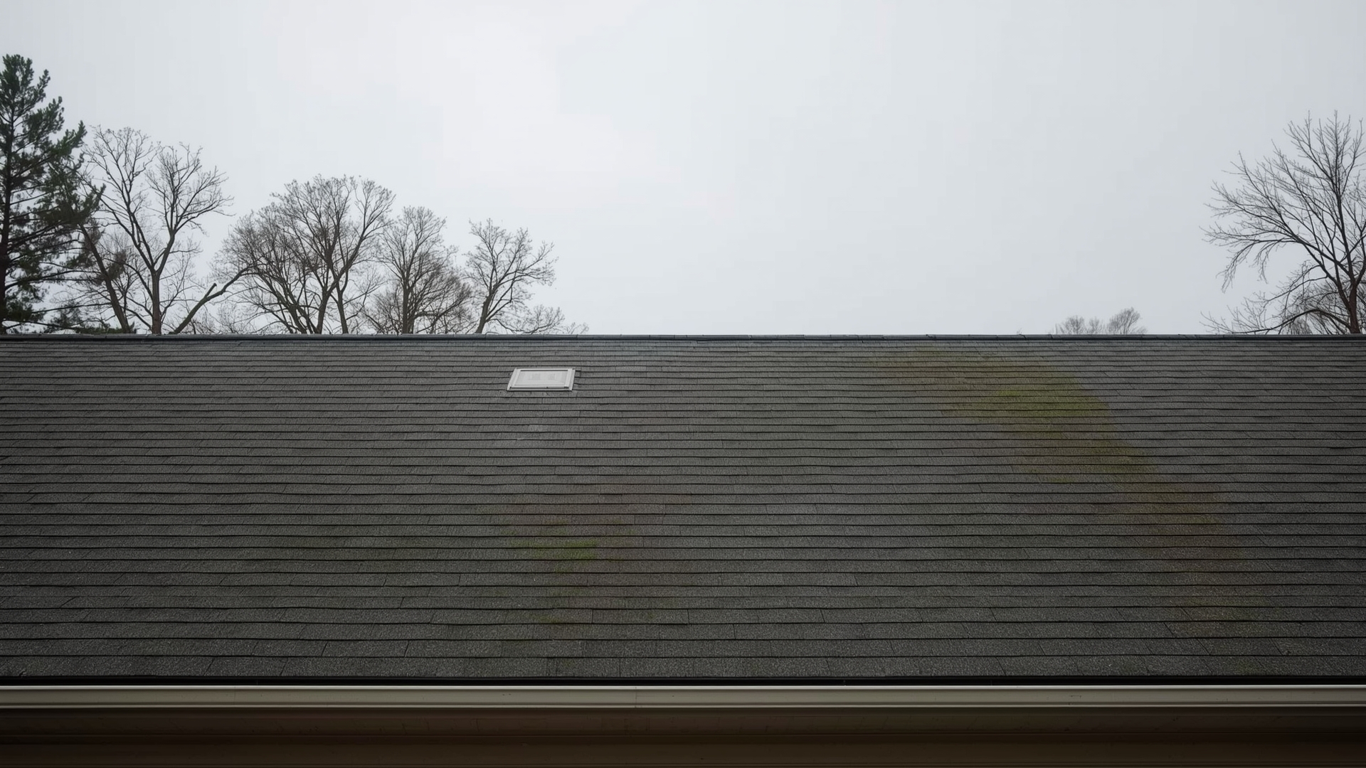 Residential home with visibly sagging roofline showing structural deterioration requiring immediate inspection